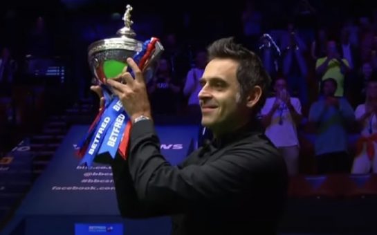 Ronnie O'Sullivan lifting a trophy