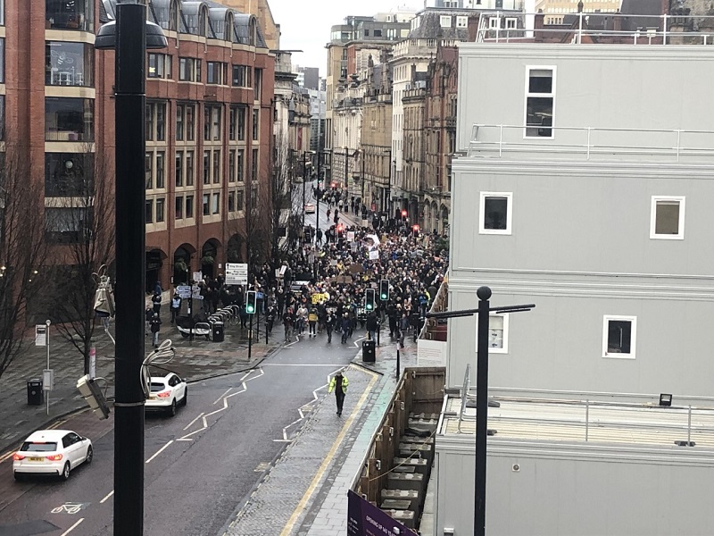 Antilockdown protesters march through Manchester city centre