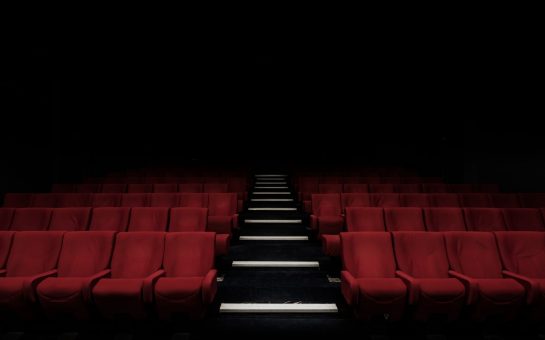empty cinema with red seats