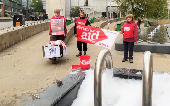 Christian Aid supporters with wheelbarrow