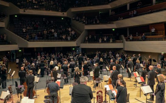 The Hallé and Sir Mark Elder receive a standing ovation on their return to live performance © The Hallé