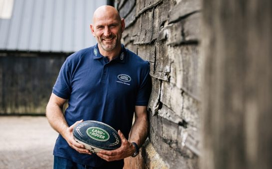 Lawrence Dallaglio holding a Land Rover rugby ball