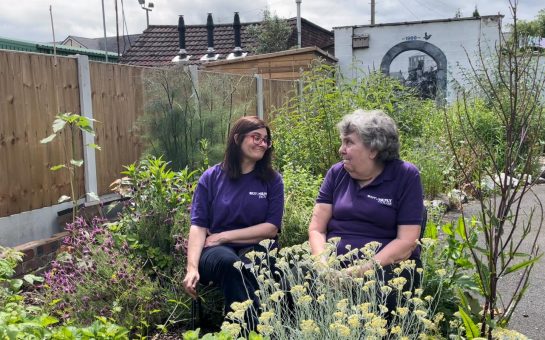 Volunteers smiling in the garden