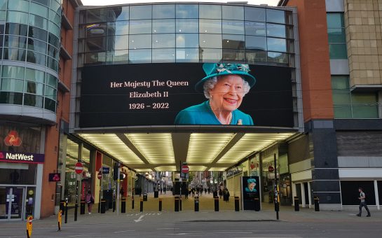 A digital advertising board in Manchester city centre displaying a portrait of Queen Elizabeth II as tribute after her death