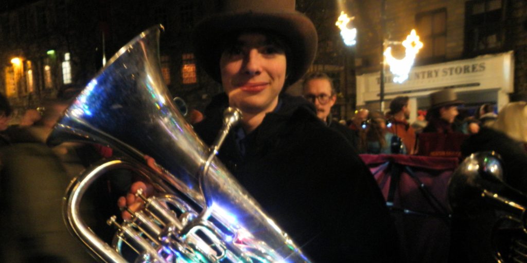 Hebden Bridge Junior Band Gabriel Bunzl, 15, holds a festive euphonium infront of the band and crowd.