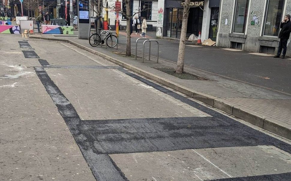 A photo of Stevenson Square, where mistakenly painted bus stops have been painted over