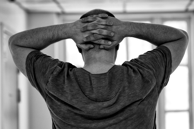 Black and white stock photo of back if male head and hands