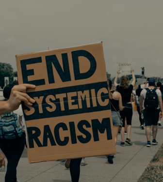 End systemic racism sign