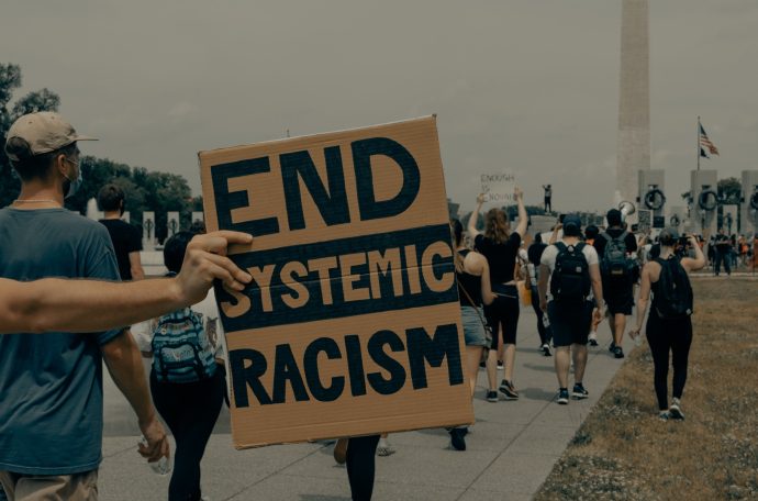 End systemic racism sign