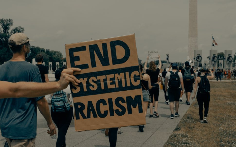 End systemic racism sign