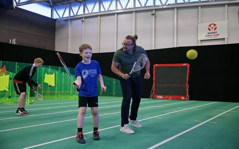 Child plays squash during the 2023 Manchester Open