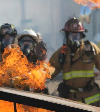 Firefighters putting flames out.