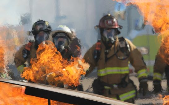 Firefighters putting flames out.