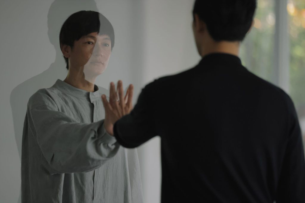 Man touching supernatural being.