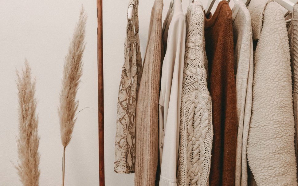 A selection of clothes hanging on a rail (Credit: Free to use from Unsplash)