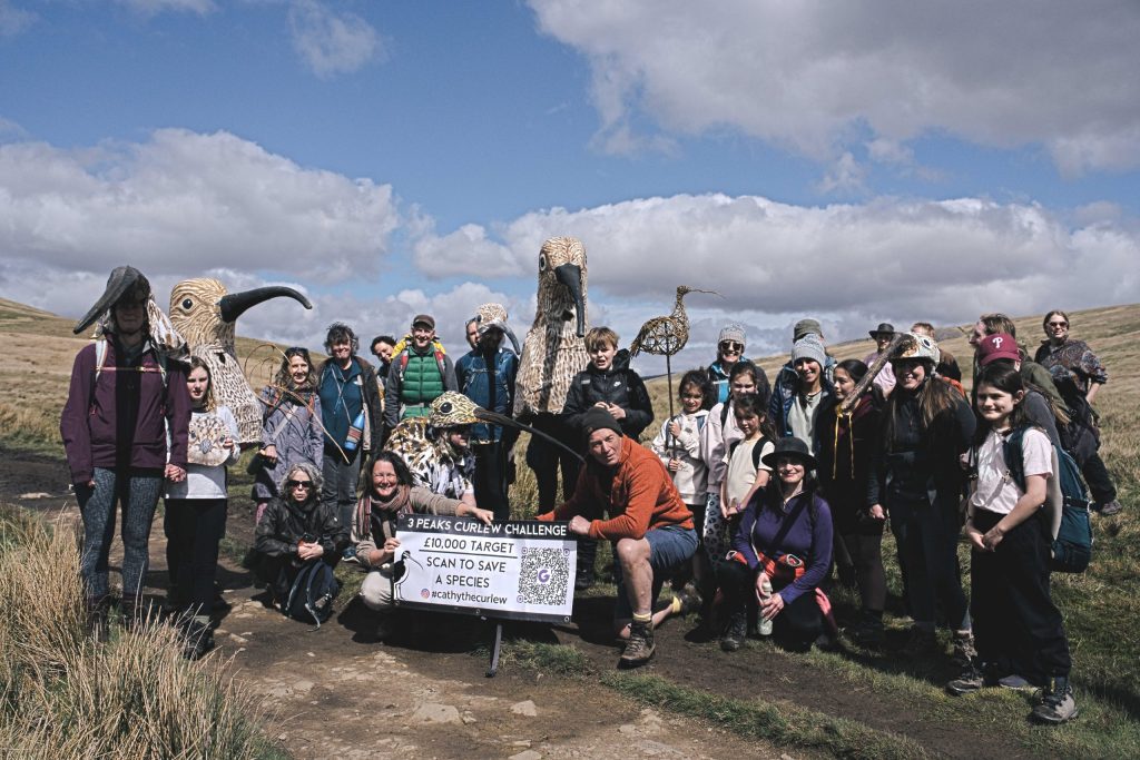 A FLOCK OF CURLEWS: Some of the hikers posing for a group photo at the bottom of Ingleborough