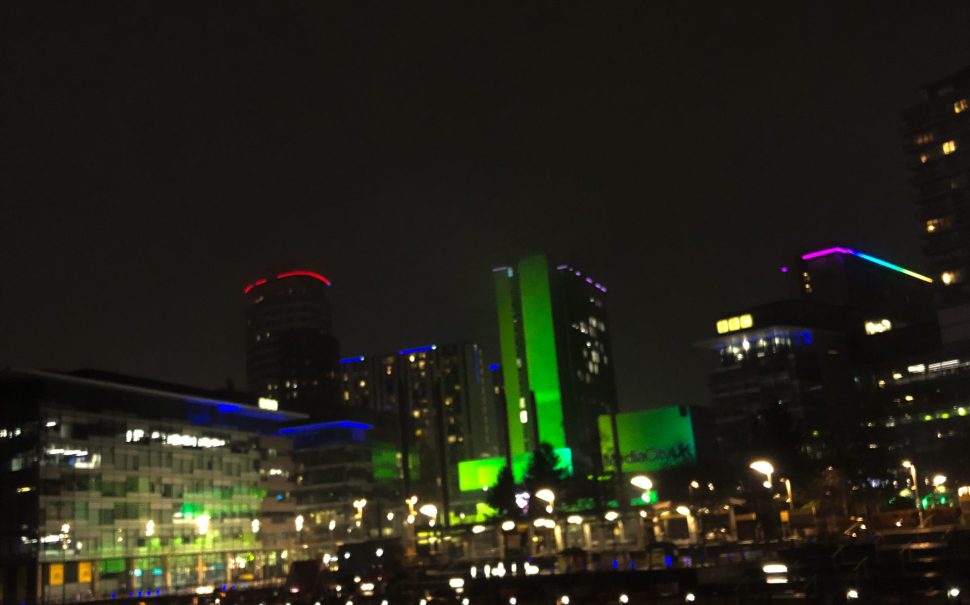 Media City in Salford at night with reflection of building lights in the water