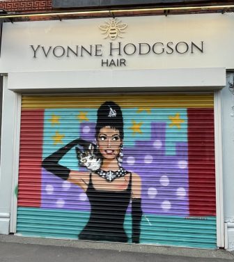 An artwork depicting Audrey Hepburn in Breakfast at Tiffany's on a business shutter