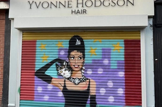 An artwork depicting Audrey Hepburn in Breakfast at Tiffany's on a business shutter